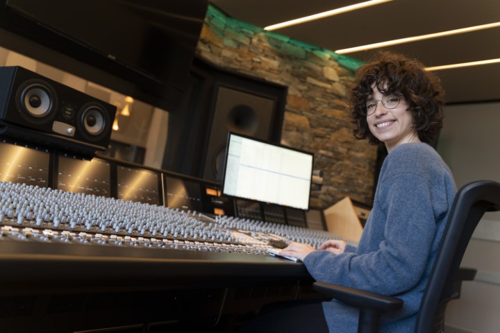 young-woman-working-in-a-music-studio-and-smiling-2023-11-27-05-03-31-utc (Small)